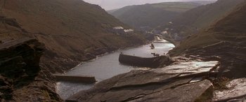 Movie still from “Oscar and Lucinda” (1997), directed by Gillian Armstrong – A body of water surrounded by mountains and rocks; Extreme Wide shot, High angle