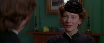 Movie still from “Oscar and Lucinda” (1997), directed by Gillian Armstrong – A person wearing a hat; Close Up shot, Over the shoulder angle