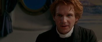 Movie still from “Oscar and Lucinda” (1997), directed by Gillian Armstrong – A person wearing a black shirt; Close Up shot, Over the shoulder angle