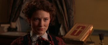 Movie still from “Oscar and Lucinda” (1997), directed by Gillian Armstrong – A person wearing a suit and tie; Close Up shot, Over the shoulder angle