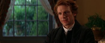 Movie still from “Oscar and Lucinda” (1997), directed by Gillian Armstrong – A person wearing a suit and tie; Close Up shot, Over the shoulder angle