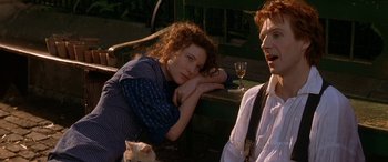 Movie still from “Oscar and Lucinda” (1997), directed by Gillian Armstrong – A man and a woman sitting next to each other; Close Up shot, High angle