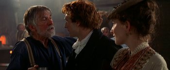 Movie still from “Oscar and Lucinda” (1997), directed by Gillian Armstrong – A group of people standing next to each other in a room; Close Up shot, Over the shoulder angle
