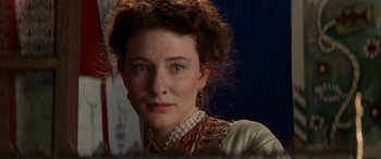 Movie still from “Oscar and Lucinda” (1997), directed by Gillian Armstrong – A person wearing a dress; Close Up shot, Over the shoulder angle