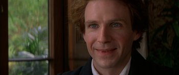 Movie still from “Oscar and Lucinda” (1997), directed by Gillian Armstrong – A man's face in a suit; Close Up shot, Over the shoulder angle
