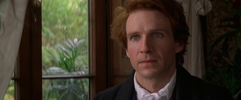 Movie still from “Oscar and Lucinda” (1997), directed by Gillian Armstrong – A person wearing a suit and tie; Close Up shot, Over the shoulder angle