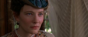 Movie still from “Oscar and Lucinda” (1997), directed by Gillian Armstrong – A person wearing a hat; Close Up shot, Over the shoulder angle