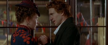 Movie still from “Oscar and Lucinda” (1997), directed by Gillian Armstrong – A man and a woman holding each other's hands; Close Up shot, Over the shoulder angle