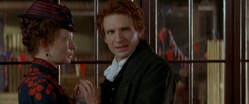 Movie still from “Oscar and Lucinda” (1997), directed by Gillian Armstrong – A man with red hair is standing next to a woman; Close Up shot, Over the shoulder angle