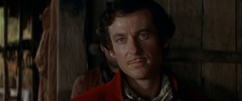 Movie still from “Oscar and Lucinda” (1997), directed by Gillian Armstrong – A person wearing a red jacket; Close Up shot, Low angle