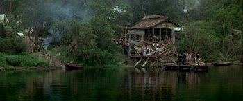 Movie still from “Oscar and Lucinda” (1997), directed by Gillian Armstrong – A group of people standing on top of a wooden platform; Extreme Wide shot, High angle