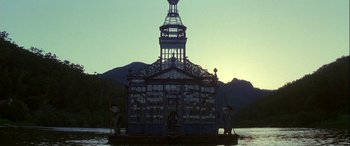 Movie still from “Oscar and Lucinda” (1997), directed by Gillian Armstrong – A building floating on top of a body of water; Extreme Wide shot, Low angle