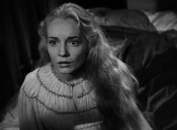 Movie still from “Othello” (1951), directed by Orson Welles – A black and white photo of a woman with long hair; Close Up shot, High angle