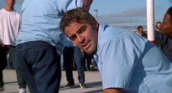 Movie still from “Out of Sight” (1998), directed by Steven Soderbergh – A person wearing a blue shirt; Close Up shot, Over the shoulder angle
