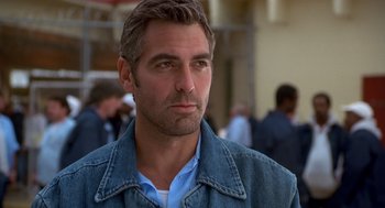 Movie still from “Out of Sight” (1998), directed by Steven Soderbergh – A person wearing a jean jacket; Close Up shot, Low angle