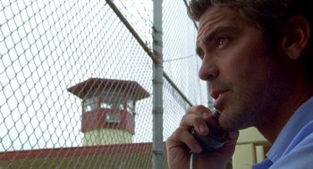 Movie still from “Out of Sight” (1998), directed by Steven Soderbergh – A person talking on a cell phone; Close Up shot, Low angle