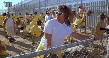 Movie still from “Out of Sight” (1998), directed by Steven Soderbergh – A group of men in yellow suits and white shirts; Wide shot, Low angle