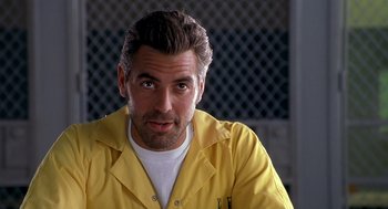 Movie still from “Out of Sight” (1998), directed by Steven Soderbergh – A person wearing a yellow shirt; Close Up shot, Low angle
