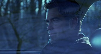 Movie still from “Out of Sight” (1998), directed by Steven Soderbergh – A person in a car looking out the window; Close Up shot, Low angle