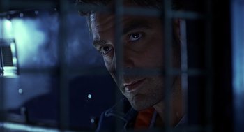 Movie still from “Out of Sight” (1998), directed by Steven Soderbergh – A person behind a fence; Close Up shot, Low angle