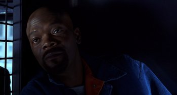 Movie still from “Out of Sight” (1998), directed by Steven Soderbergh – A person looking up at the sky; Close Up shot, Overhead angle