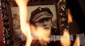 Movie still from “Out of the Blue” (1980), directed by Dennis Hopper – A picture of a man wearing a military hat; Extreme Close Up shot, Low angle