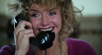 Movie still from “Out of the Blue” (1980), directed by Dennis Hopper – A person talking on a phone; Close Up shot, Over the shoulder angle