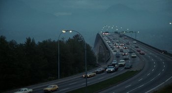 Movie still from “Out of the Blue” (1980), directed by Dennis Hopper – A bunch of cars on a highway at night; Extreme Wide shot, High angle