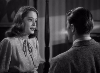 Movie still from “Out of the Past” (1947), directed by Jacques Tourneur – A woman talking to another woman in a room; Close Up shot, Over the shoulder angle