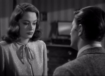 Movie still from “Out of the Past” (1947), directed by Jacques Tourneur – A man and a woman talking to each other; Close Up shot, Over the shoulder angle