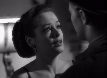 Movie still from “Out of the Past” (1947), directed by Jacques Tourneur – A black - and - white photo of a woman and a man; Close Up shot, Over the shoulder angle