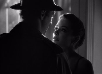 Movie still from “Out of the Past” (1947), directed by Jacques Tourneur – A man and a woman are looking into each others eyes; Close Up shot, Over the shoulder angle