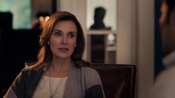 Movie still from “13 Reasons Why” (2017), created by Brian Yorkey – A person sitting in a chair; Close Up shot, Over the shoulder angle