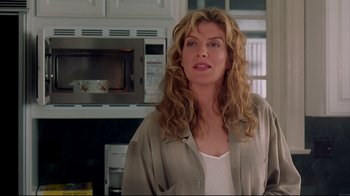 Movie still from “Outbreak” (1995), directed by Wolfgang Petersen – A woman standing in front of a microwave oven; Close Up shot, Low angle