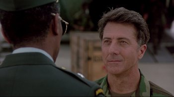 Movie still from “Outbreak” (1995), directed by Wolfgang Petersen – A man in a military uniform talking to another man in a uniform; Close Up shot, Over the shoulder angle