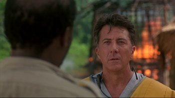 Movie still from “Outbreak” (1995), directed by Wolfgang Petersen – A person talking to another person; Close Up shot, Over the shoulder angle