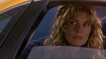 Movie still from “Outbreak” (1995), directed by Wolfgang Petersen – A person in a car looking out of the window; Close Up shot, Over the shoulder angle