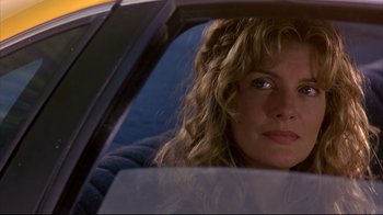 Movie still from “Outbreak” (1995), directed by Wolfgang Petersen – A person sitting in a car looking out the window; Close Up shot, Over the shoulder angle