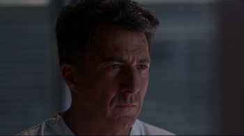 Movie still from “Outbreak” (1995), directed by Wolfgang Petersen – A person wearing a white shirt; Close Up shot, Low angle