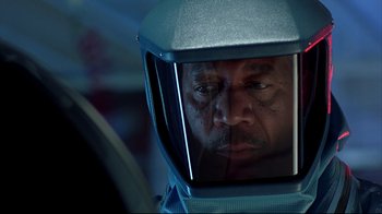 Movie still from “Outbreak” (1995), directed by Wolfgang Petersen – A person wearing a space helmet; Close Up shot, Over the shoulder angle
