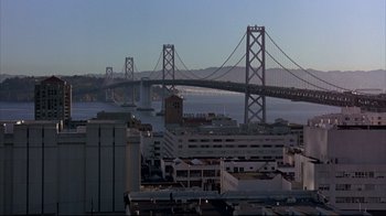 Movie still from “Outbreak” (1995), directed by Wolfgang Petersen – A view of the bay bridge from a distance; Extreme Wide shot, High angle