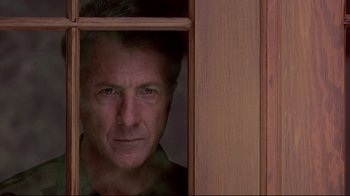 Movie still from “Outbreak” (1995), directed by Wolfgang Petersen – A person looking through a window; Close Up shot, Low angle
