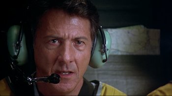 Movie still from “Outbreak” (1995), directed by Wolfgang Petersen – A man with a headset is looking into the distance; Close Up shot, Low angle