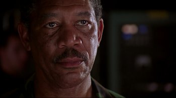 Movie still from “Outbreak” (1995), directed by Wolfgang Petersen – A person with a mustache; Close Up shot, Low angle