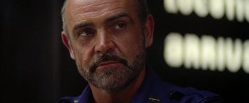 Movie still from “Outland” (1981), directed by Peter Hyams – A person with a beard; Close Up shot, Low angle