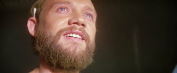 Movie still from “Outland” (1981), directed by Peter Hyams – A person with a beard; Extreme Close Up shot, Low angle