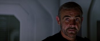 Movie still from “Outland” (1981), directed by Peter Hyams – A person looking at the camera; Close Up shot, Low angle