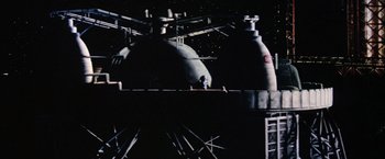 Movie still from “Outland” (1981), directed by Peter Hyams – An image of a space station in the night sky; Extreme Wide shot, Low angle