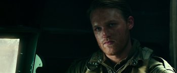 Movie still from “Overlord” (2018), directed by Julius Avery – A person wearing a military uniform; Close Up shot, Low angle