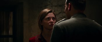 Movie still from “Overlord” (2018), directed by Julius Avery – A man and a woman standing next to each other; Close Up shot, Over the shoulder angle